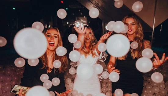 A picture of adult ball pit at a Newcastle club called Howlers featuring three women having a night out