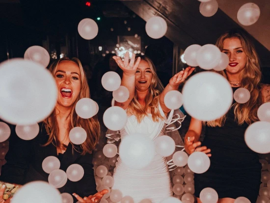 A picture of adult ball pit at a Newcastle club called Howlers featuring three women having a night out