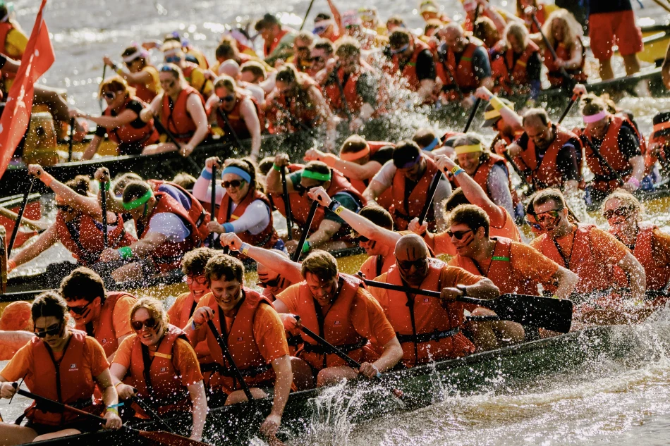 Boats racing side by side on the River Tyne during the Dragon Boat Race