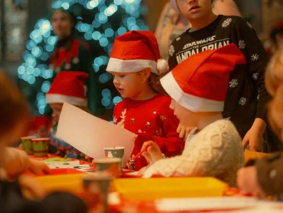 Children doing Christmas crafts at Newcastle Cathedral as part of NE1's Search for Santa