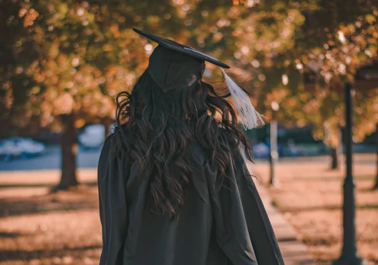 A young female graduate - Image courtesy Pexels & Stanley Morales