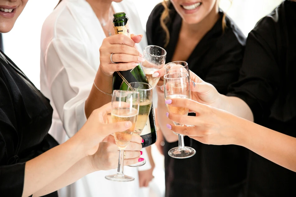 Women Celebrating and Holding Wineglasses and Champagne, Photo by Serdar Aksoy, Free to use under the Pexels License